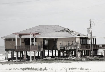 wind damage - spray foam can help prevent uplift to Norman roofs